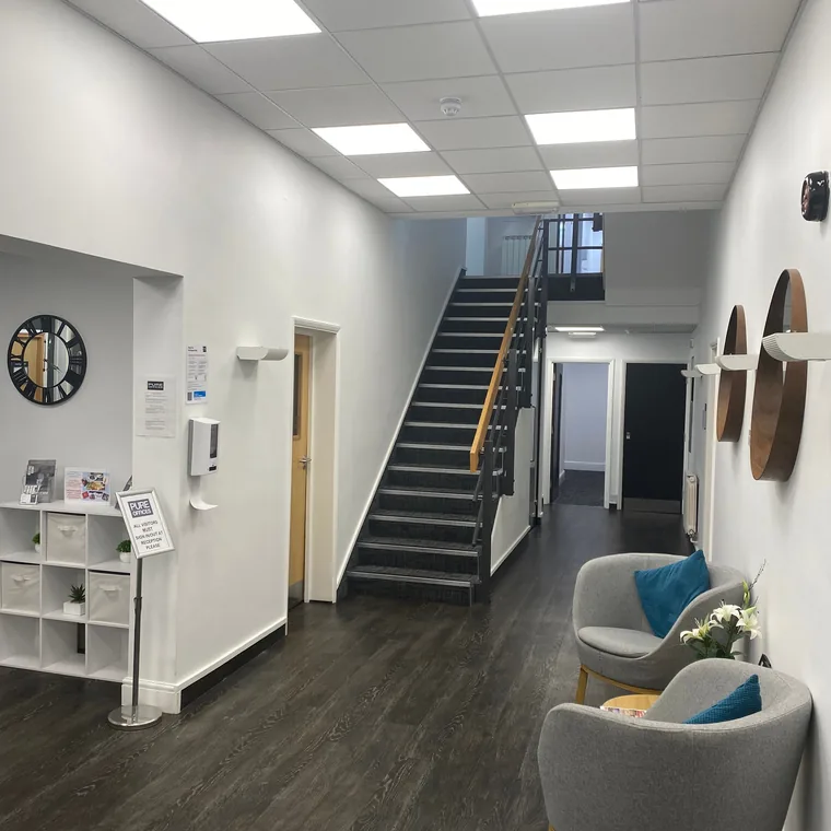 Office block communal area lit with new LED tile panel lighting by HC Pyramid Electrical LTD